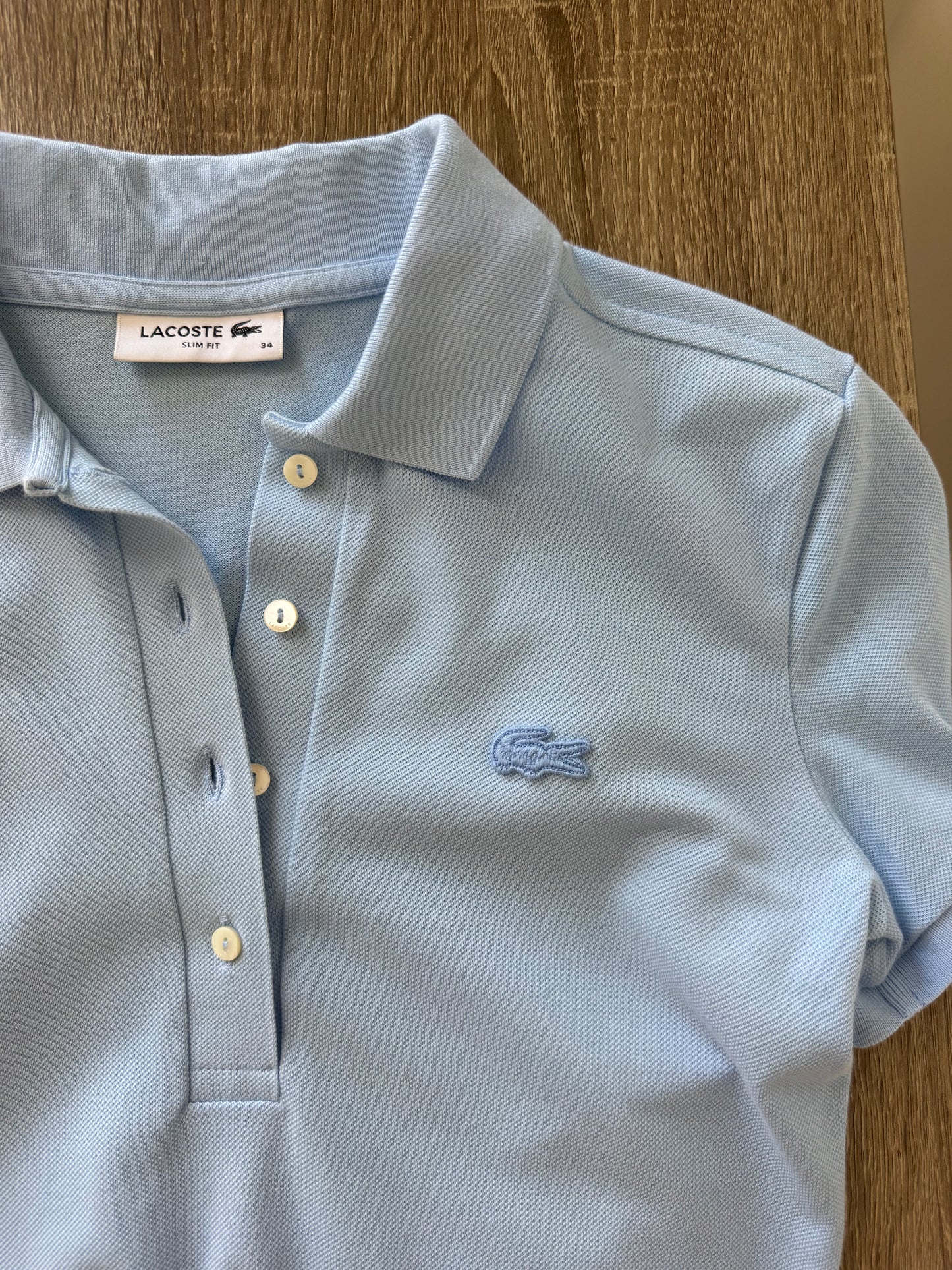 Tricou Lacoste din 100% bumbac baby blue 
(Mărimea xs/s)